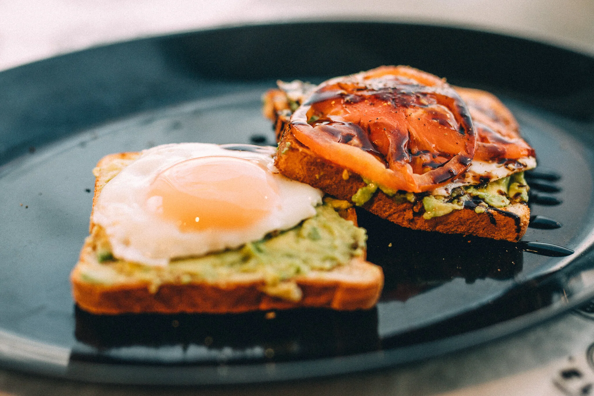 Two prepared breakfast toasts from Not Just Bagels